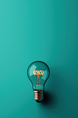Glowing Lightbulb Filament on Teal Background Minimalist Design Concept for Creativity and Inspiration