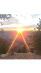 A breathtaking sunset over a canyon, illuminating the landscape with vibrant colors.