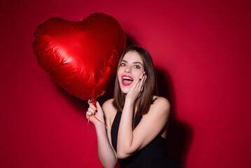 Valentines day, love heart. Portrait of lovely valentine girl hold red heart. Beautiful woman celebrate valentines day. Woman in love. Woman on valentines party. Symbol of love. Valentine card.