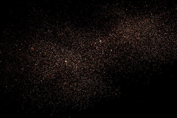 Blurry garland lights on a dark background. Festive Christmas and New Year background. Soft focus. Image toned in color of 2025 year - Mocha Mousse