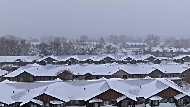 Aerial shot over Midvale Utah neighborhood with intense snow storm