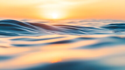 Obraz premium A serene and blurred photograph of the sea at sunset, capturing the calming hues of the setting sun reflected on the water. Perfect for backgrounds, travel themes, or relaxation concepts.