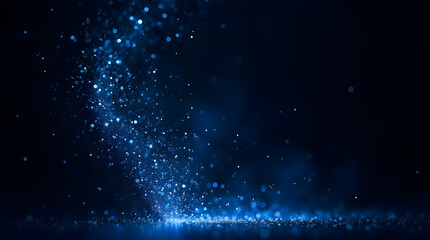Obraz premium Stunning Blue Particle Effect Lighting Up the Dark Background with Sparkling Dust