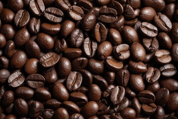 Fototapeta premium a close up of a pile of coffee beans with a few pieces missing