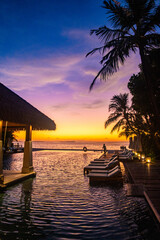 Sunset views from overwater pool villa in Maldives
