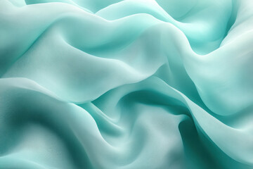 Obraz premium Flowing turquoise sheer fabric texture background.