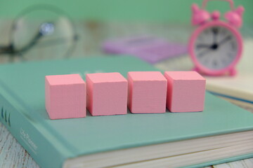 Wooden block, alarm clock with no word as a template for text space concept. business concept