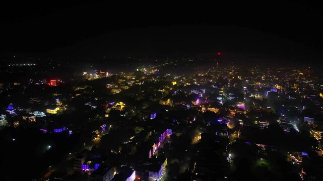 aerial drone hyperlapse shot showing indian city jaipur delhi gurgaon rajasthan during diwali makar sankranti with fireworks shooting up and colorful lights on houses