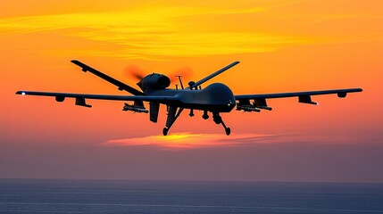 Fototapeta premium Drone Flying Against a Bright Orange Sunset Over the Ocean