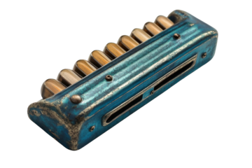 Vintage Blue Harmonica: A weathered teal harmonica, showcasing its aged patina and intricate details. This antique musical instrument evokes a sense of nostalgia and history.