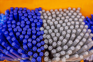Ballpoint pens for school on a yellow background. Back to school, office supplies