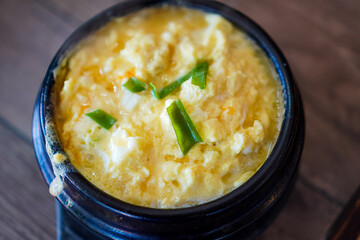 Top view photo of ready-to-eat Korean Steamed Egg on a dining table.