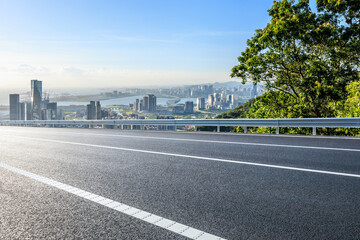 Asphalt highway road and city skyline with modern buildings scenery in Shenzhen. Outdoor road background.