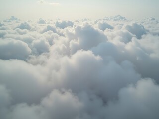 Obraz premium Aerial view of fluffy white clouds creating a dreamlike atmosphere