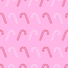 Vector seamless pattern with white and red candy canes on a pink background