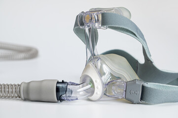 Continuous positive airway pressure- mask (CPAP) and hose isolated on white background