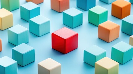 Obraz premium Colorful wooden blocks with one red cube in the center