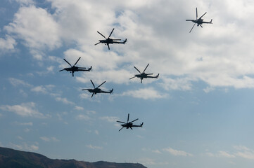 Russian combat helicopter Mi-28N, night hunter (NATO: Havoc). Golden eagles. Four Mi-28N helicopters perform group aerobatics. Hydroaviation show - 2014. Gelendzhik, Russia, September 4, 2014