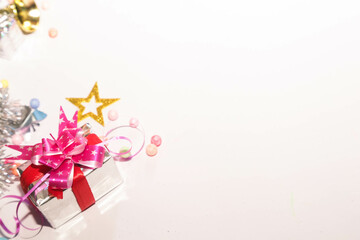 Season's greetings scene. Christmas decorations,gift boxes with red ribbons, сhristmas balls, ...