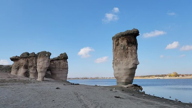 Magical rock formations by the side of the Lake Emre which is a serene natural oasis, surrounded by lush greenery and ancient rock formations in the heart of Phrygian Valley in Afyonkarahisar.