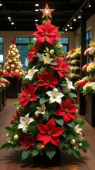 Christmas tree adorned with Christmas ornaments and large red and white flowers, poinsettias and lilies, glowing star on top, blurred flowers shop in background. Christmas in flower shop concept.