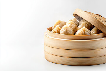 bamboo steamer filled with freshly steamed dumplings on white background
