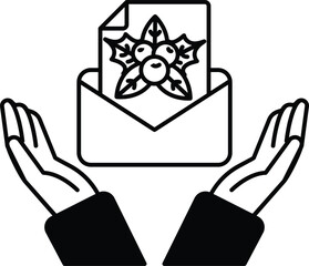 A hand holding an envelope with a black and white design on it