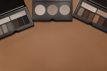 Palette of colorful eyeshadows from high view. New trending colour of the 2025 year 