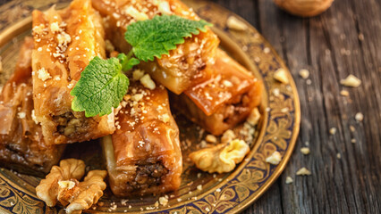 Traditional arabic dessert Baklava with honey and walnuts.