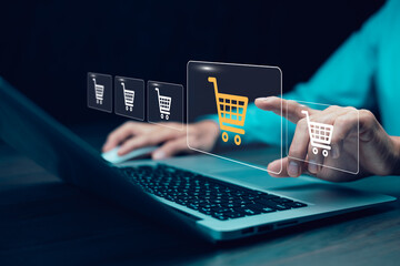 Businessman hold smartphone with online shopping concept, marketplace website with virtual interface of online Shopping cart part of the network, Online shopping business with selecting shopping cart.