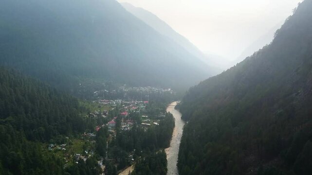 Aerial view of himalayan mountains at kasol himachal pradesh. Small villages and colorful local houses nested in the hills of parvati valley at kasol, himachal pradesh, India.