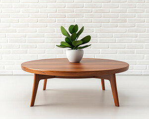 A stylish wooden coffee table with a round top, featuring a potted plant, set against a clean, white brick wall.