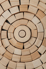 Fototapeta premium Wooden blocks arranged in spiral pattern, symbolizing growth and harmony