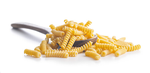 Uncooked italian pasta. Fusilli pasta on spoon isolated on white background.