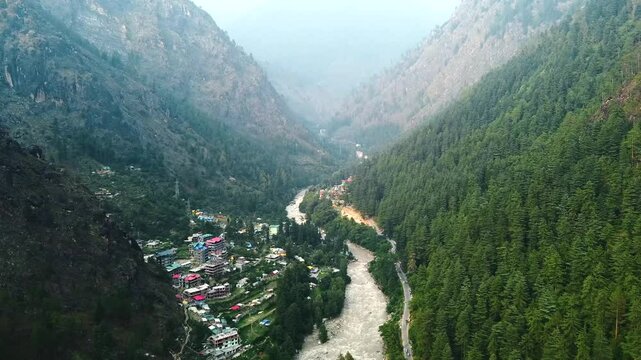 Aerial view of himalayan mountains at kasol himachal pradesh. Small villages and colorful local houses nested in the hills of parvati valley at kasol, himachal pradesh, India.