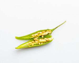 cut green chili pepper on white background