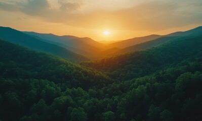 Breathtaking Sunrise Over Lush Green Mountains with Rolling Hills and Vibrant Sky Illuminating Natural Landscape in Majestic Wilderness