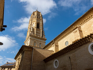 Detail shot of the impressive Mudejar tower of Utebo on a sunny day with the blue sky in the background.