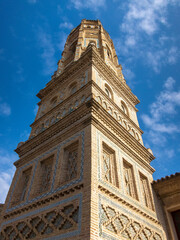 Detail shot of the impressive Mudejar tower of the small village of Utebo in Aragon, with the blue...