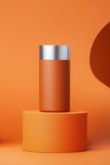 Orange insulated tumbler on orange platform against orange background.