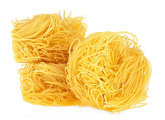 Italian tagliatelle pasta nests isolated on a white background. Italian egg pasta.