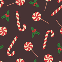 Seamless pattern with candy canes, lollipops and holly on brown background. Traditional red and white Christmas sweets. Vector flat illustration for wallpaper, textile, packaging