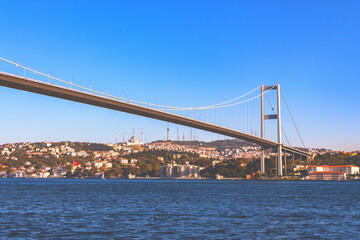 Bosphorus Strait with Istanbul skyline and suspension bridge on a clear day in Turkey