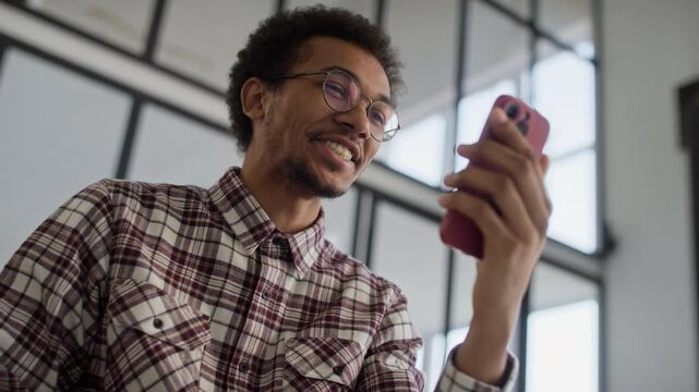 Man Smiling While Speaking on a Video Call
