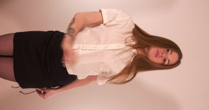 Sexy beautiful Girl Dancing and teasing while caressing herself in a very provocative way. Vertical shot