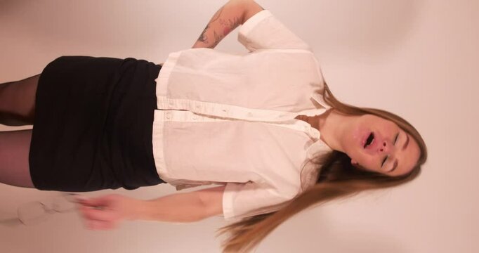 Beautiful girl nagging to the camera. Vertical shot