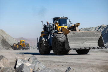 Heavy Construction Machinery at Work in Open Pit Mine.
