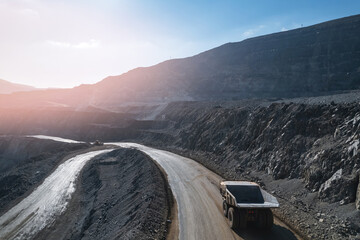 big yellow truck working in gold quarry, Aerial top view Industry Open pit mining