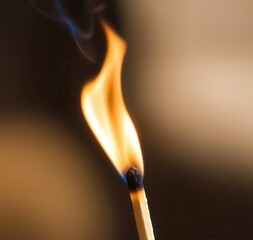 Matchstick is lit and the flame is yellow