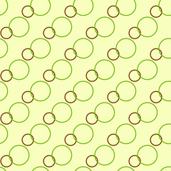 Seamless pattern with colored rings on yellow